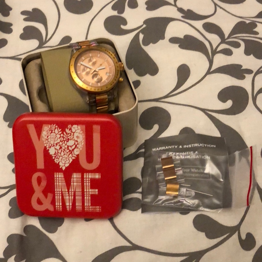 Rose gold and clear fossil watch